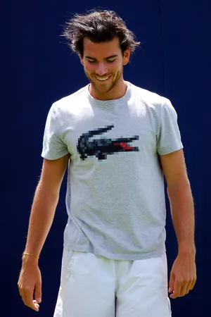 A Man Wearing A Tee Shirt Wallpaper