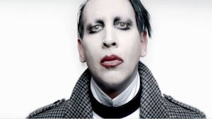 A Man With Makeup And A Coat Wallpaper