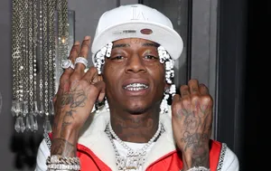 A Man With Tattoos And A Hat Wallpaper