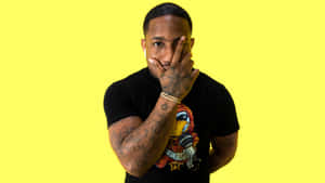 A Man With Tattoos On His Face Posing For A Picture Wallpaper