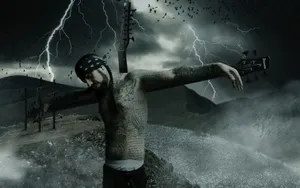 A Man With Tattoos Standing On A Cross With Lightning Wallpaper