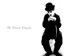 A Mesmerizing Shot Of Charlie Chaplin During One Of His Heartfelt Moments. Wallpaper