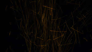 A Modern Black And Gold Desktop Computer Setup With Black Monitor Stand Wallpaper