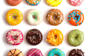 A Mouthwatering Display Of Assorted Donuts Wallpaper