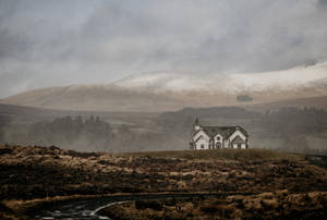 A Mystical Valley Framed By A Dense Fog And A Silent Castle Wallpaper