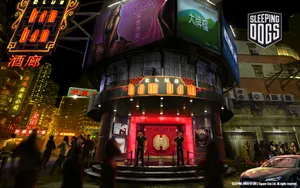 A Night Scene With People Walking Around A Building Wallpaper