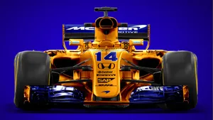 A Orange Racing Car On A Blue Background Wallpaper