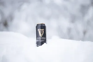 A Perfect Guinness Moment: Chilled Irish Stout In Snow Wallpaper