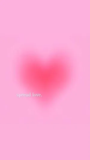 A Pink Heart With The Words Spread Love Wallpaper
