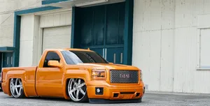 A Powerful Low Truck With 4 Wheel Drive For Any Job Wallpaper