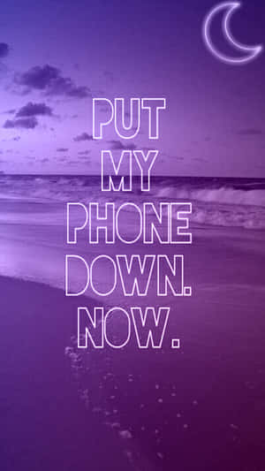 A Purple Beach With The Words Put My Phone Down Now Wallpaper