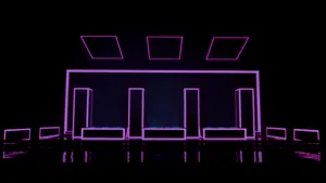 A Purple Light Is Shown In A Dark Room Wallpaper