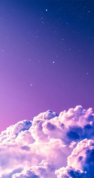 A Purple Sky With Clouds And Stars Wallpaper