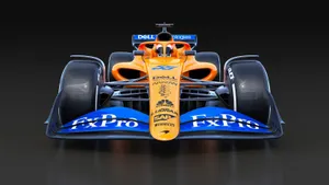 A Racing Car With A Blue And Orange Color Wallpaper