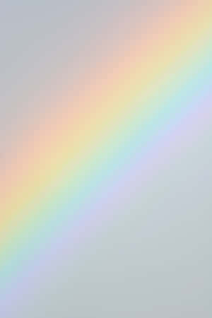 A Rainbow Is Shown On A Gray Background Wallpaper