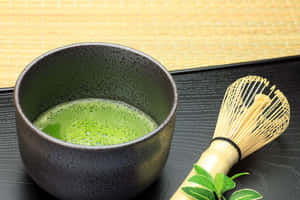 A Refreshing Cup Of Vibrant Green Matcha Tea Wallpaper