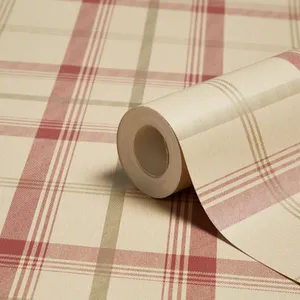 A Roll Of Plaid Wallpaper On A Table Wallpaper