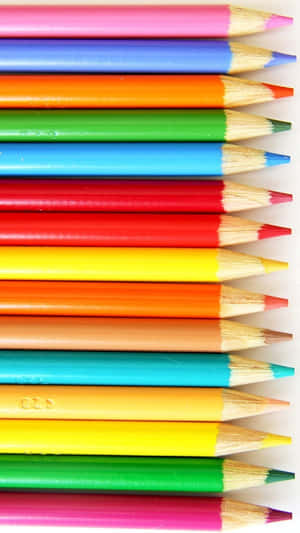 A Row Of Colored Pencils On A White Background Wallpaper