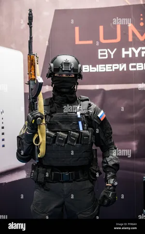 A Russian Soldier In A Uniform Stands In Front Of A Display Of A - Stock Image Wallpaper