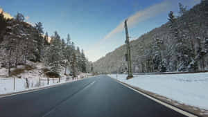 A Serene Snowy Landscape In The Winter Wallpaper