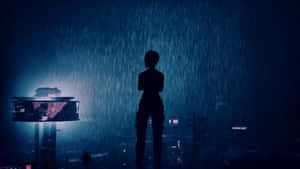A Silhouette Of A Person Standing In The Rain Wallpaper