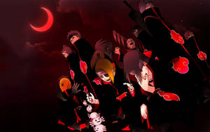 A Silhouette Of Akatsuki Outlined In A Red Moon, Standing Vigilant Against All Adversaries Wallpaper