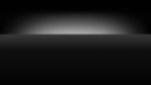 A Sleek And Sophisticated Black Surface Design. Wallpaper