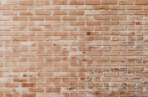 A Sturdy Array Of Cemented Orange Bricks Wallpaper