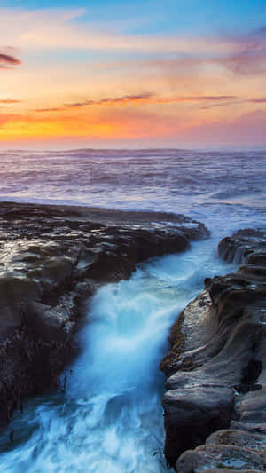 A Submerged Iphone Showing Resilient Durability Against Water Wallpaper