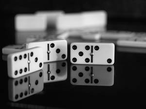 A Thrilling Domino Game In Full Swing Wallpaper