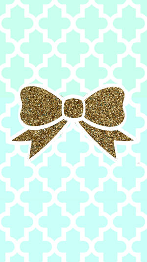 A Tiffany Blue Box Wrapped In Gold Ribbon Wallpaper