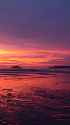 A Tranquil Sunset View Of The Beach On An Iphone Wallpaper