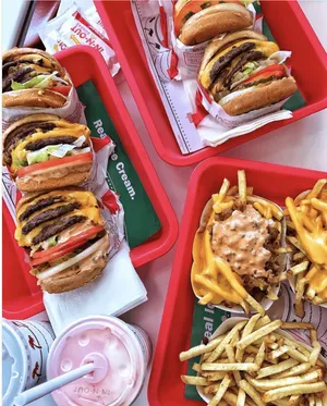 A Tray Of Food With Fries And A Burger Wallpaper
