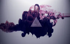 A Triangle With Smoke Coming Out Of It Wallpaper