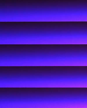 A Vibrant Striped Gradient Featuring Shades Of Purple Wallpaper