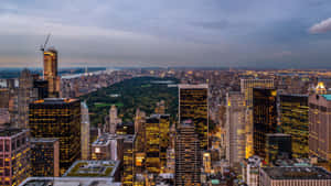 A View Of The City From The Top Of A Building Wallpaper