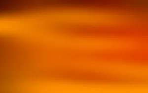 A Warm, Vibrant Sunset In Light Orange. Wallpaper