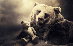 A Wild Grizzly Bear With A Cute Teddy Bear Wallpaper