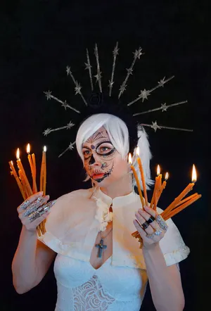 A Woman Holding Candles Wallpaper