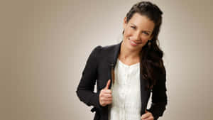 A Woman In A Black Jacket And White Shirt Posing Wallpaper