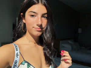 A Woman In A White Bikini Taking A Selfie Wallpaper