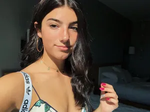 A Woman In A White Bikini Taking A Selfie Wallpaper