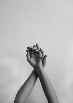 A Woman's Hands Are Raised In The Air Wallpaper