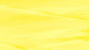 A Yellow Aesthetic Computer That Adds A Hit Of Color To Any Workspace. Wallpaper