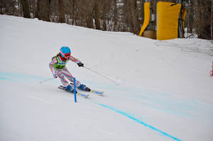 A Young Skier Mastering The Slopes Of Alpine Skiing Wallpaper