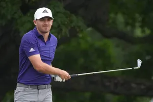 Aaron Wise Holding His Golf Club Wallpaper