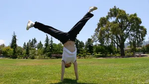 Acrobatic Cartwheel Tumbling In The Park Wallpaper