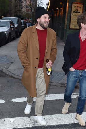 Actor Jonah Hill Looking Cool While Wearing A Cap And Sunglasses. Wallpaper