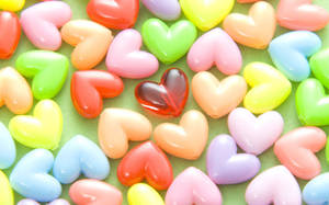 Add A Splash Of Color To Your Home With This Vibrant Display Of Hearts. Wallpaper