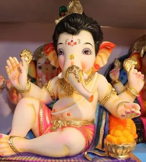 Adorable Pink Themed Ganesha Statue Wallpaper